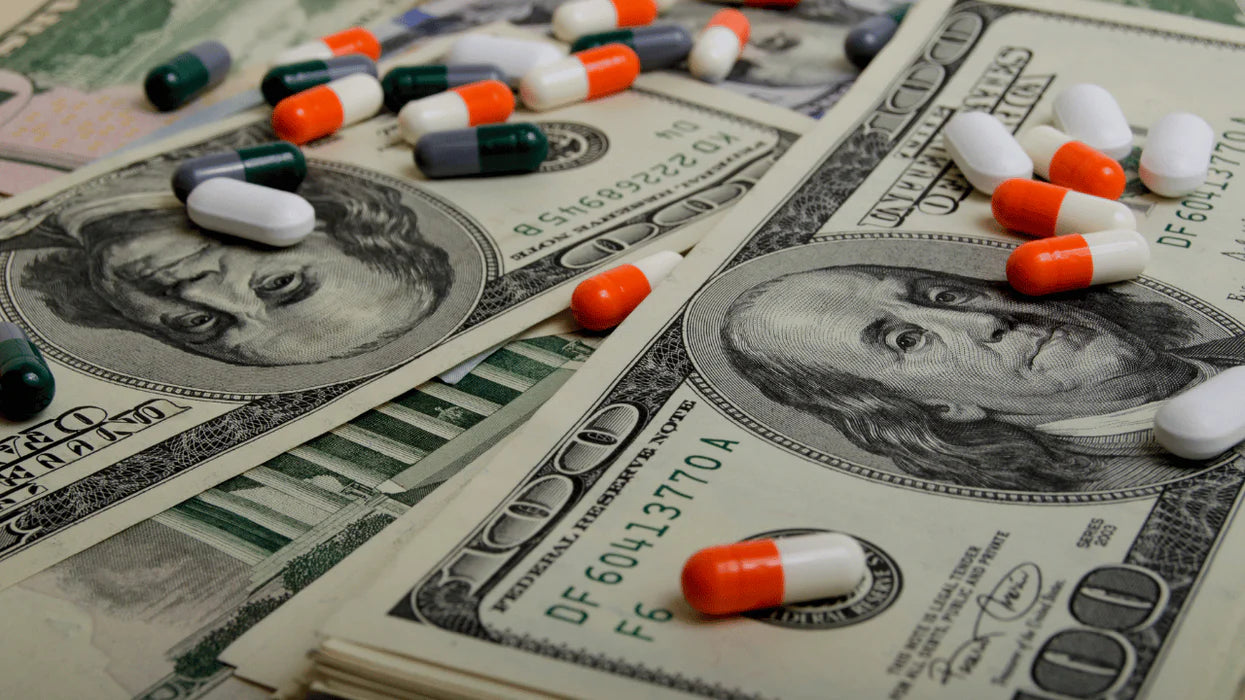 Medication and money illustrating the cost of care